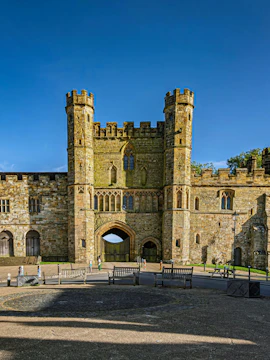 Battle Abbey gatehouse with stone towers in East Sussex, England.