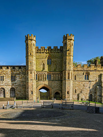 Battle Abbey gatehouse with stone towers in East Sussex, England.