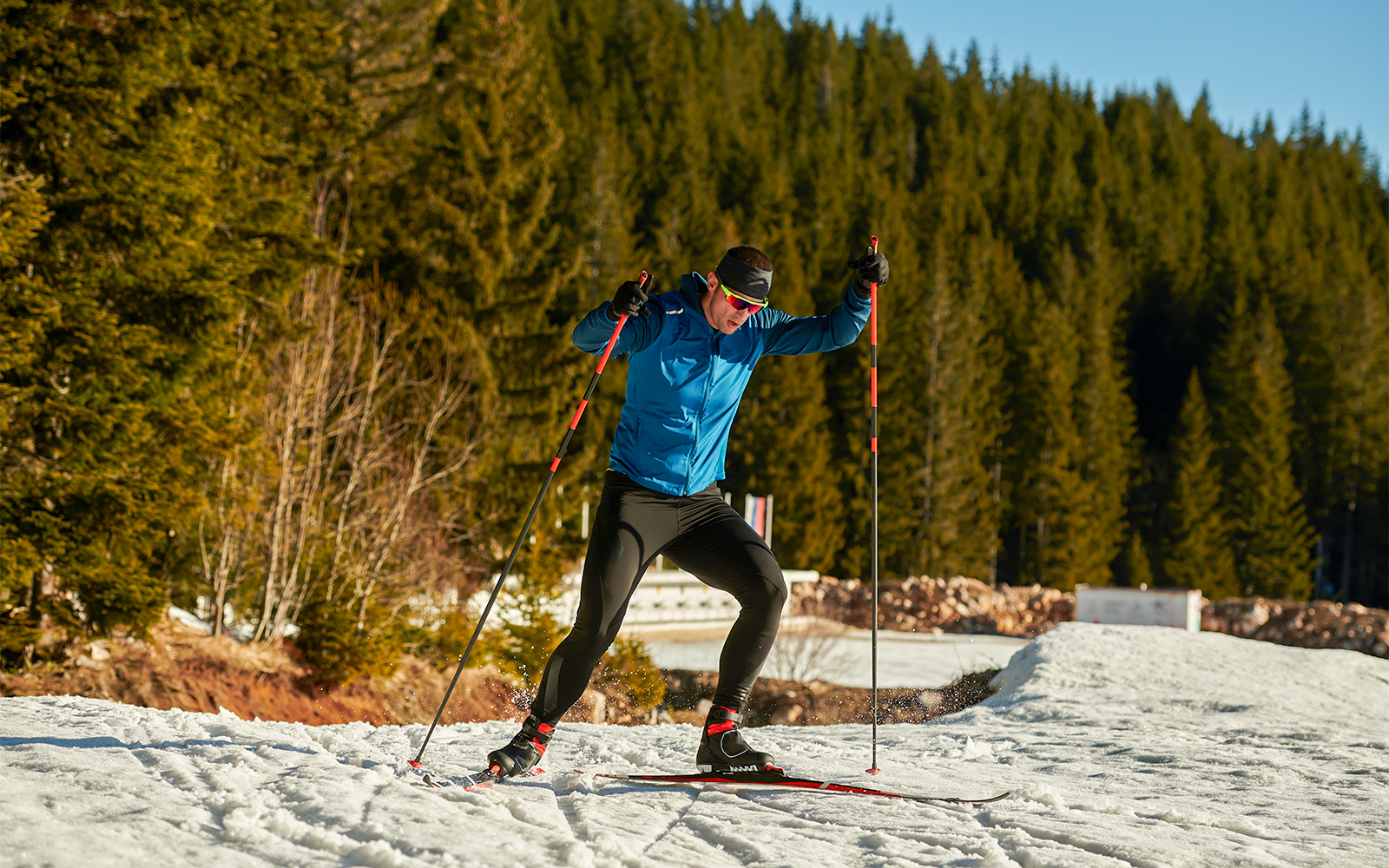 Visitors enjoying the ESCAPE Penang Ski Slope in Malaysia, showcasing artificial snow and ski activities.