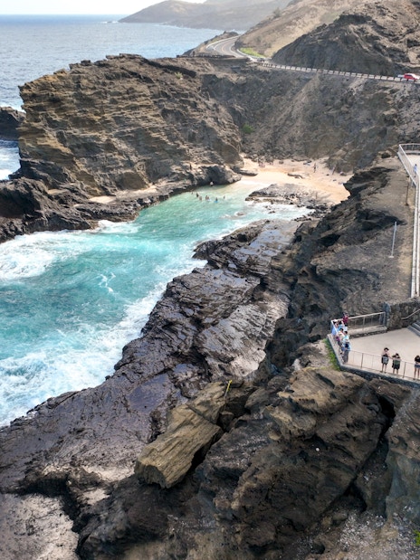 Aerial view of Halona Beach Cove and Halona Blowhole with visitors, Oahu, Hawaii.