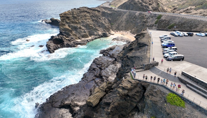 Aerial view of Halona Beach Cove and Halona Blowhole with visitors, Oahu, Hawaii.