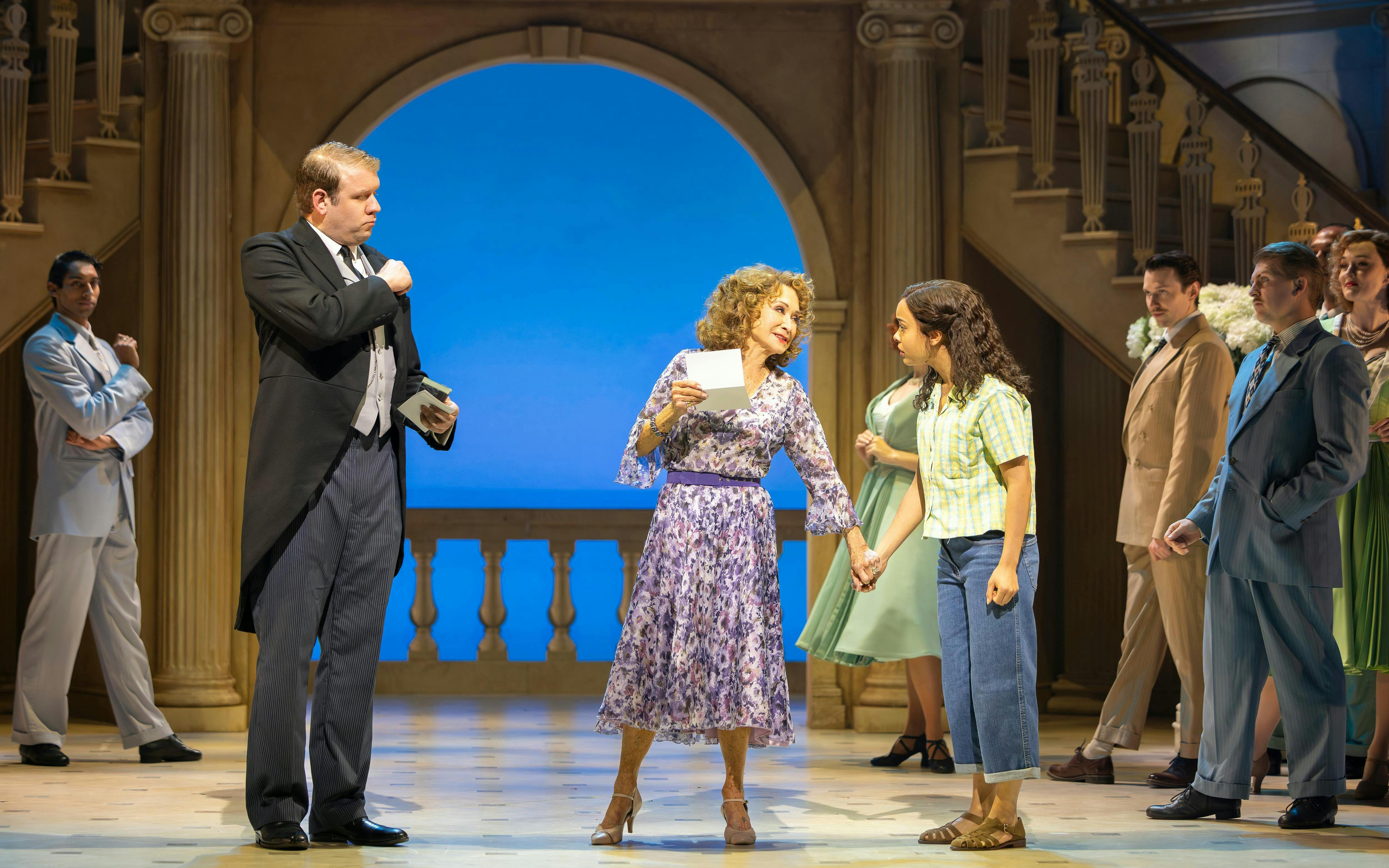 Stage performance of High Society in West End with actors in formal attire.