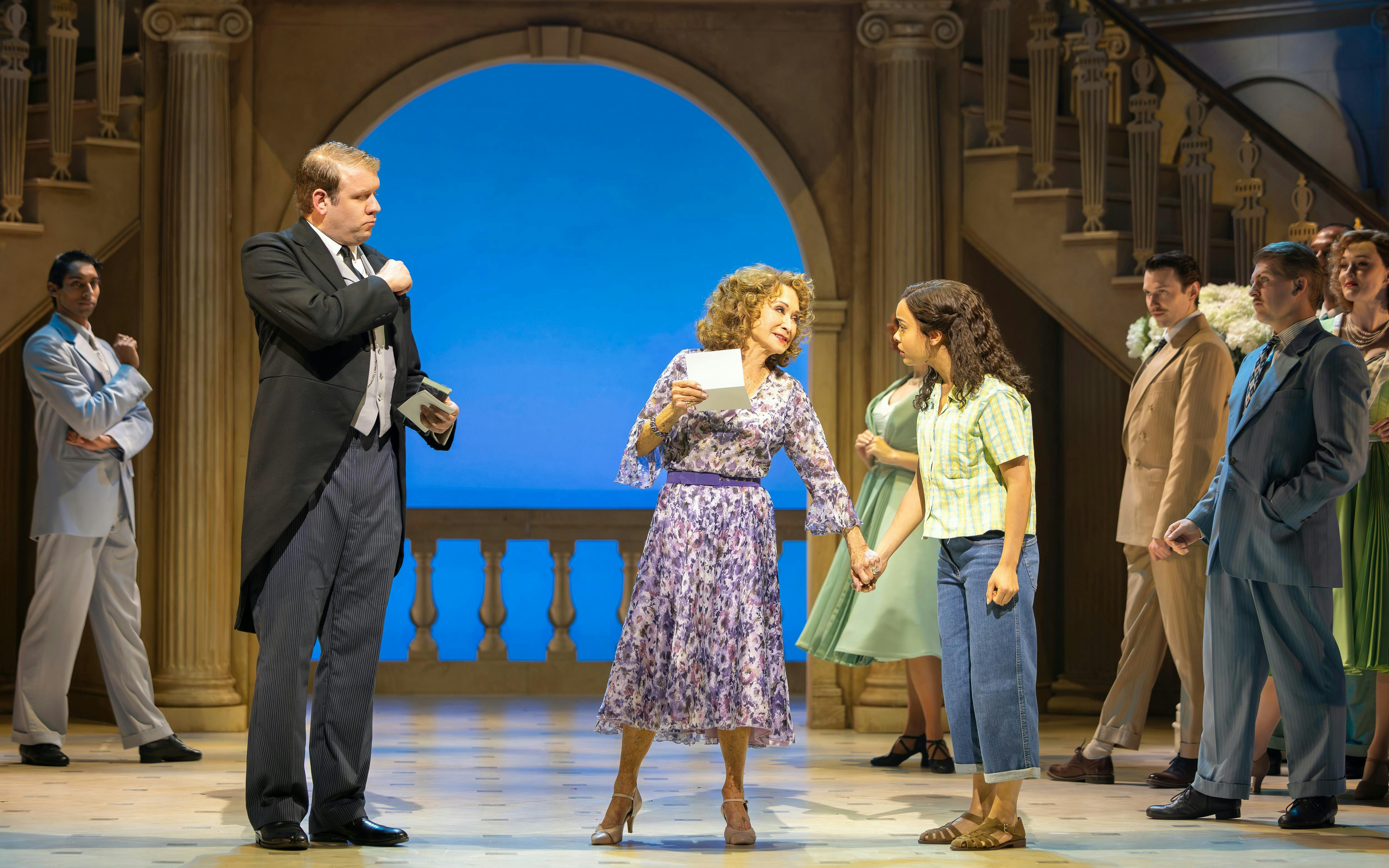 Stage performance of High Society in West End with actors in formal attire.
