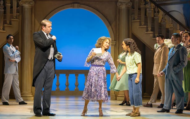 Stage performance of High Society in West End with actors in formal attire.
