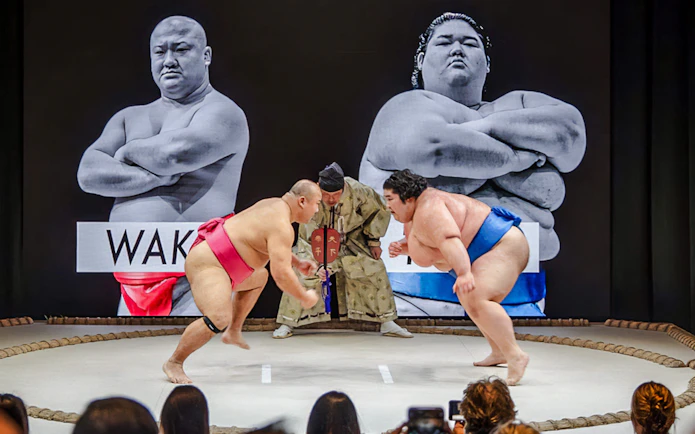Sumo wrestlers competing at The Sumo Hall Hirakuza in Osaka.