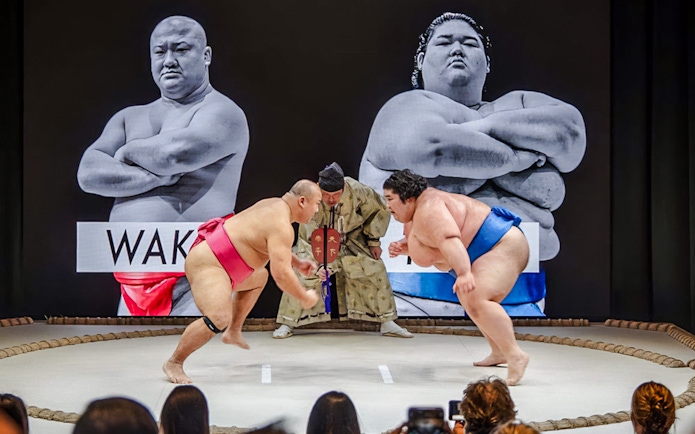 Sumo wrestlers competing at The Sumo Hall Hirakuza in Osaka.