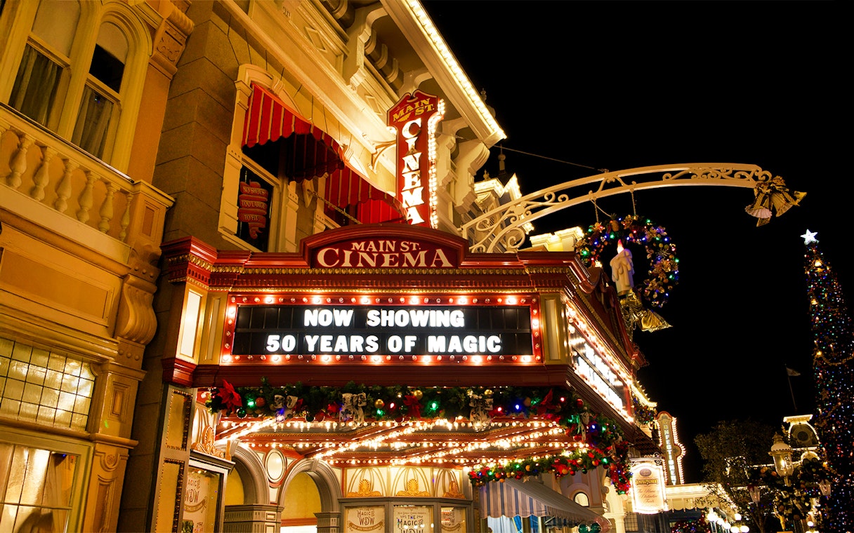 Main Street Cinema marquee at Walt Disney World Orlando, displaying "50 Years of Magic" sign.