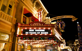 Main Street Cinema marquee at Walt Disney World Orlando, displaying "50 Years of Magic" sign.