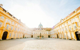Melk Abbey courtyard with fountain, part of Hallstatt Highlights Day Trip from Vienna.