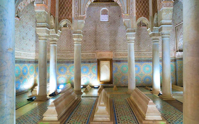 Saadian Tombs interior with ornate columns and mosaic tiles in Marrakech.