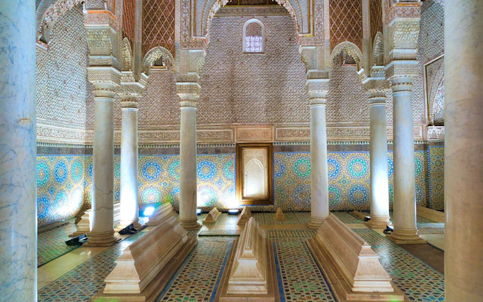 Saadian Tombs interior with ornate columns and mosaic tiles in Marrakech.