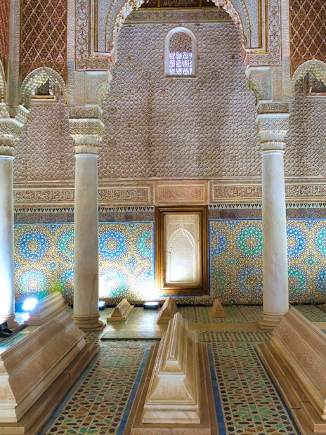 Saadian Tombs interior with ornate columns and mosaic tiles in Marrakech.