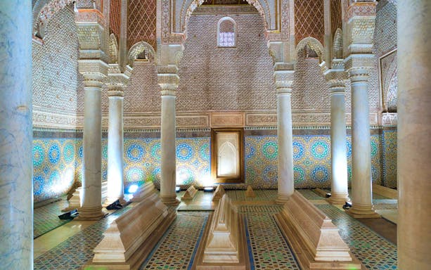 Saadian Tombs interior with ornate columns and mosaic tiles in Marrakech.