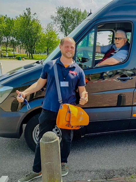 Tour guide and driver with van for Keukenhof transfer in Amsterdam.