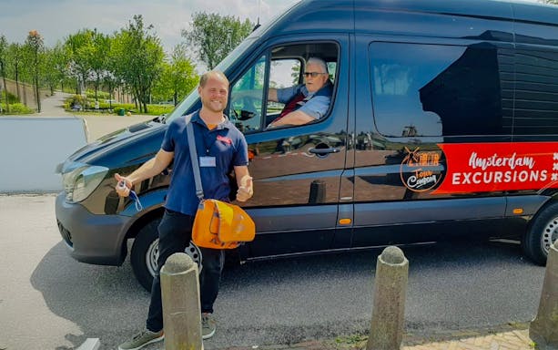 Tour guide and driver with van for Keukenhof transfer in Amsterdam.