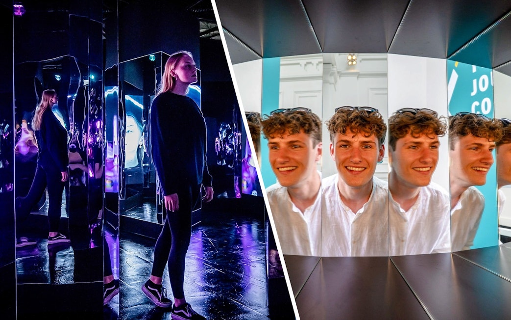 Guests exploring mirror illusions at the Museum of Illusions Amsterdam.