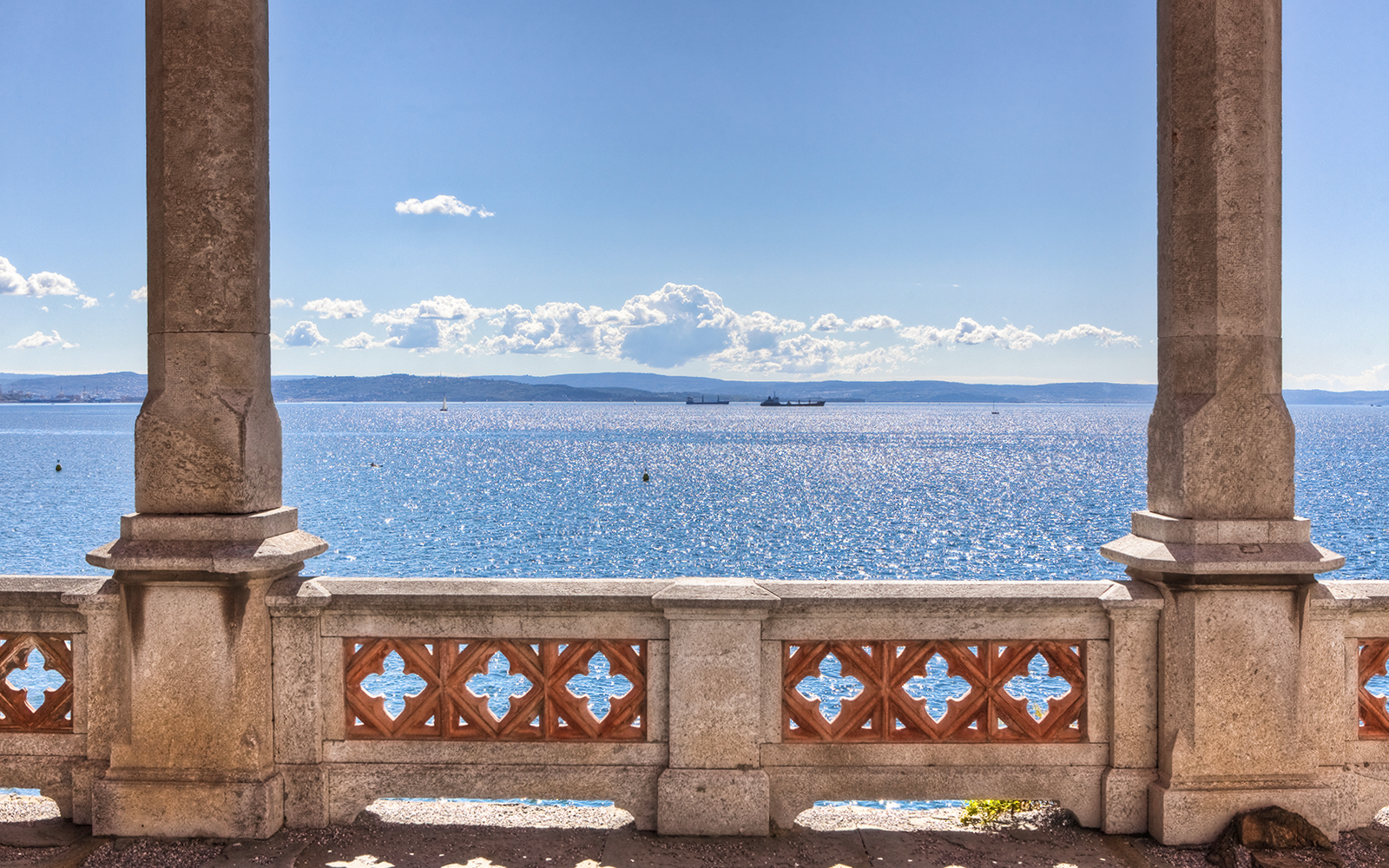 Balcony view of the sea from Miramare Castle, Trieste, with distant ships.