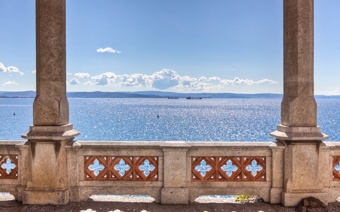 Balcony view of the sea from Miramare Castle, Trieste, with distant ships.