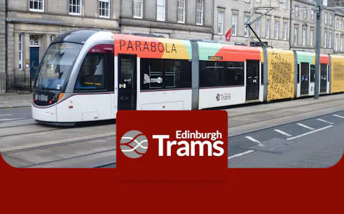 Edinburgh tram on city street, part of round-trip service to/from Edinburgh Airport.