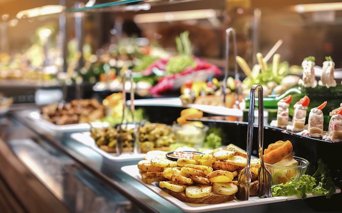 Breakfast buffet with assorted dishes in Ras Al Khaimah before hot air balloon ride.