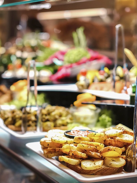 Breakfast buffet with assorted dishes in Ras Al Khaimah before hot air balloon ride.