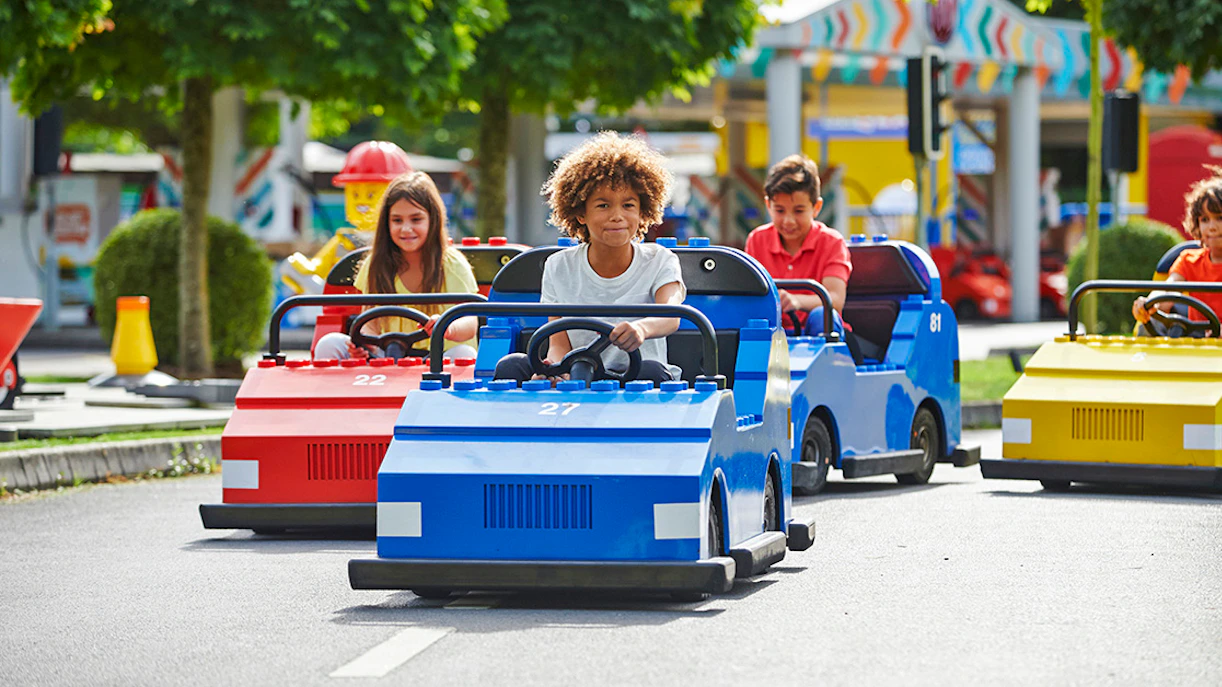 Children driving mini cars at Legoland Windsor.