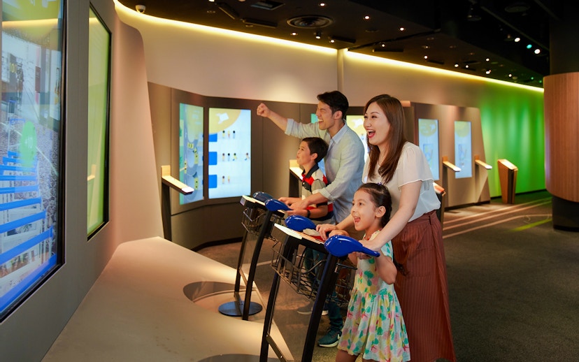 Family enjoying interactive games at Changi Experience Studio, Singapore.