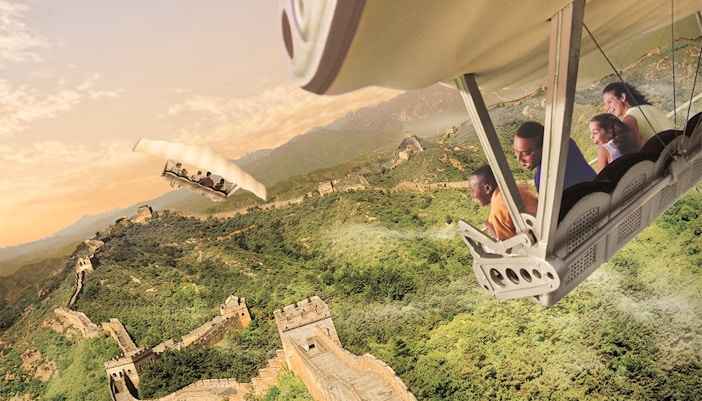 Guests on a ride flying over the Great Wall of China at Disneyland Park, California.