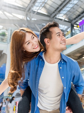 Couple enjoying Malaysia airport transfer service.