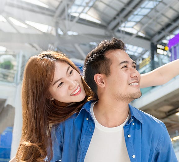 Couple enjoying Malaysia airport transfer service.