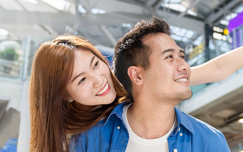 Couple enjoying Malaysia airport transfer service.