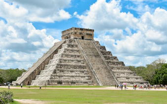 Tourists exploring the pyramid at Chichen Itza, Mexico.