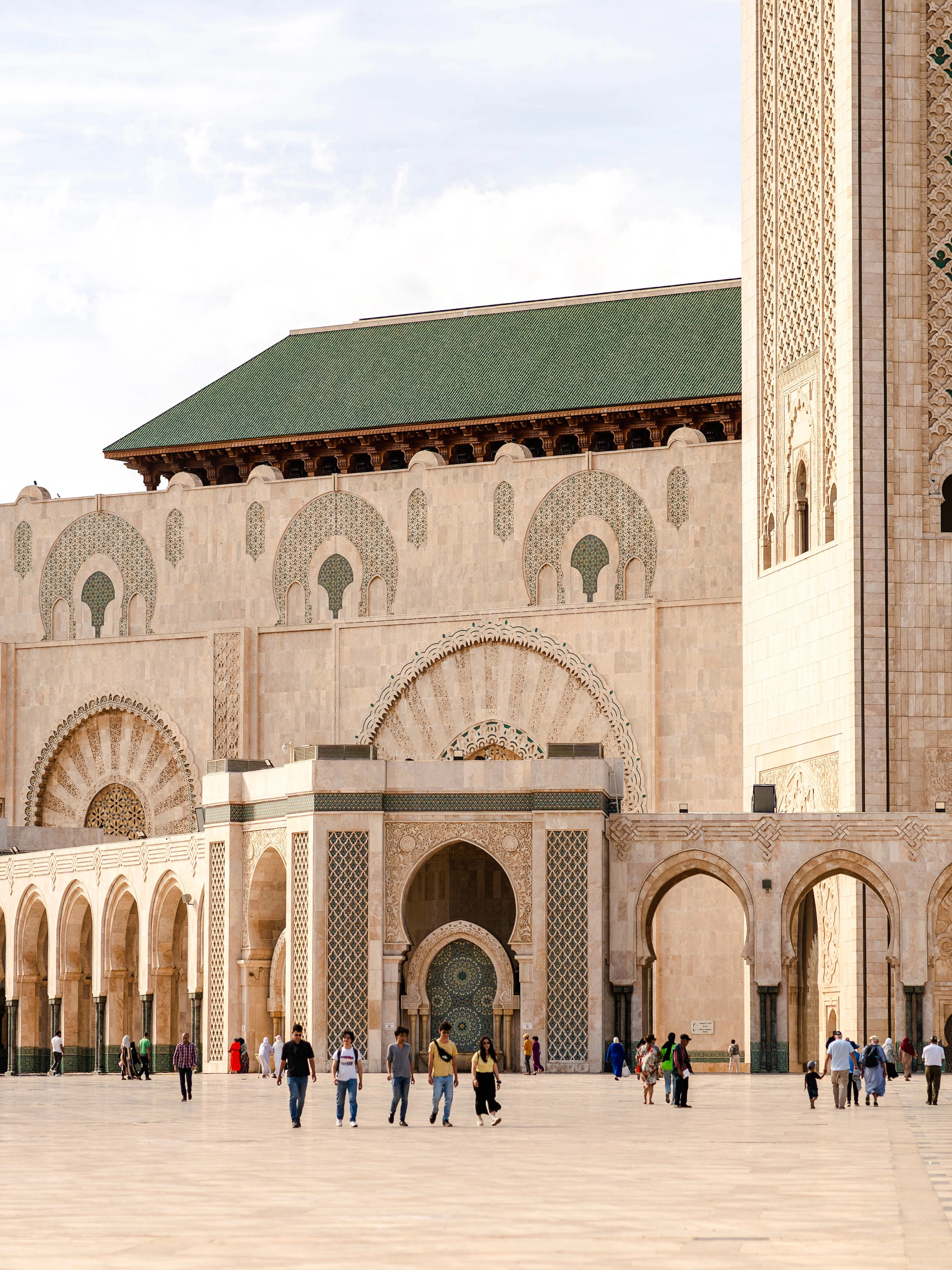 Hassan II Mosque exterior with arches and minaret, Casablanca.