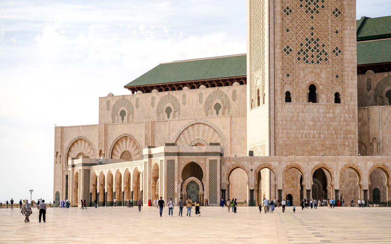 Hassan II Mosque exterior with arches and minaret, Casablanca.