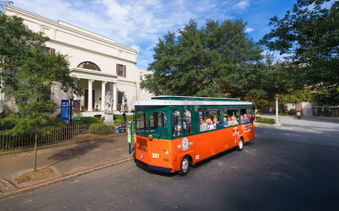 Savannah hop-on hop-off trolley passing Telfair Museum.
