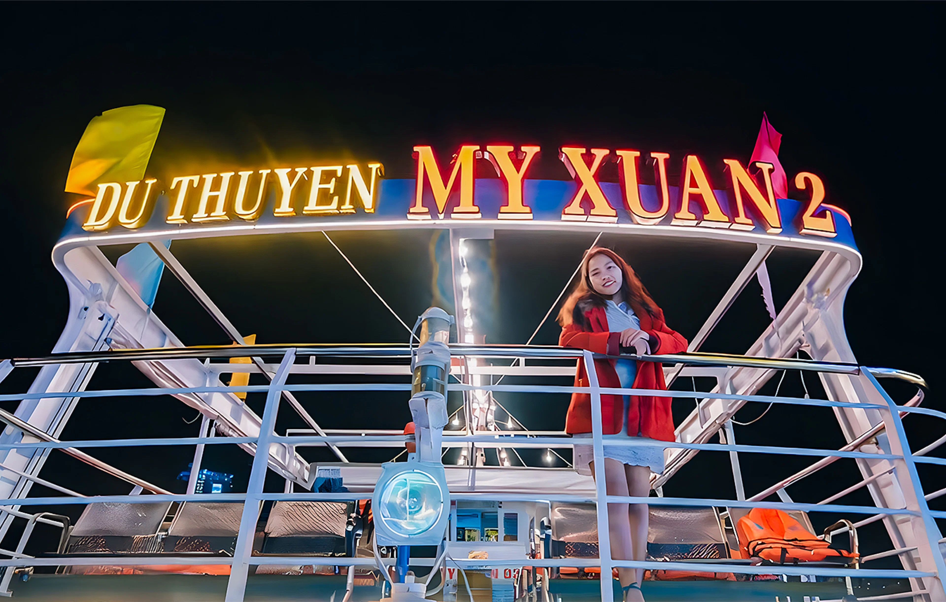 My Xuan cruise ship on Han River at night with a person on deck.