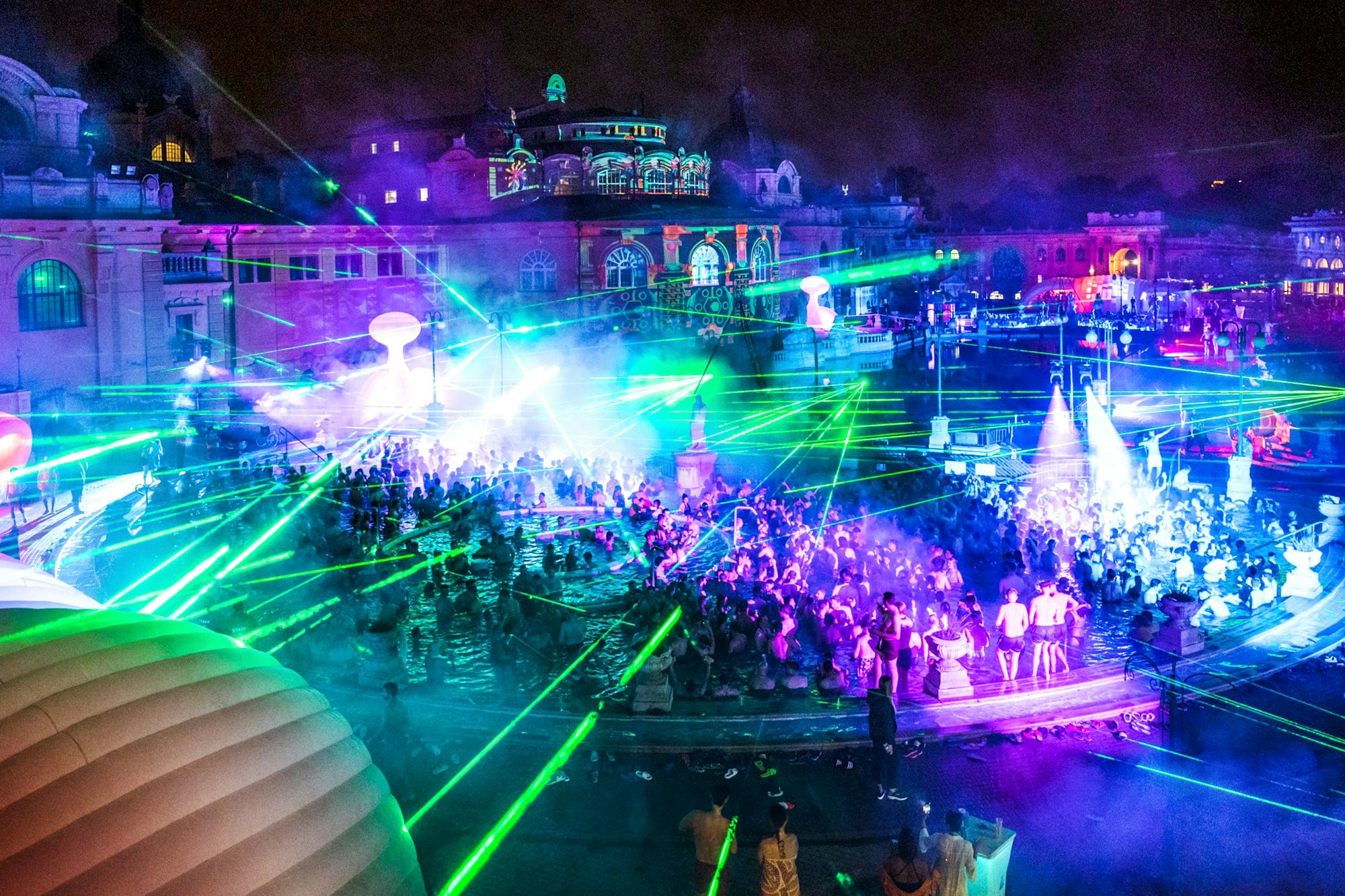 People enjoying a night pool party at Széchenyi Thermal Bath, Sparty Budapest.