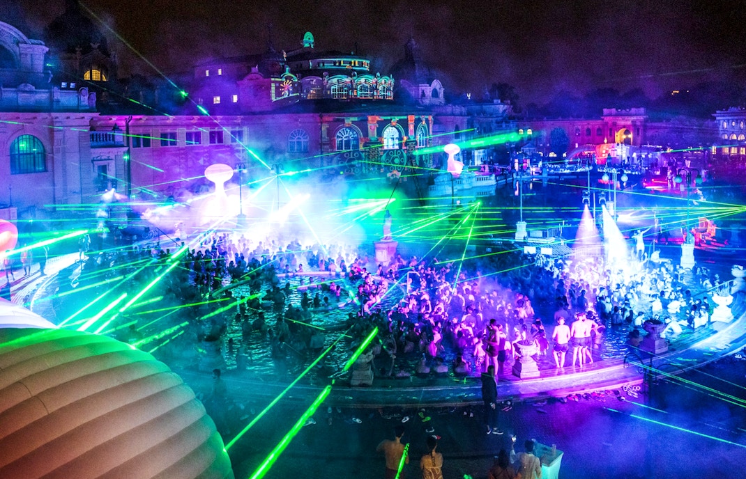 People enjoying a night pool party at Széchenyi Thermal Bath, Sparty Budapest.