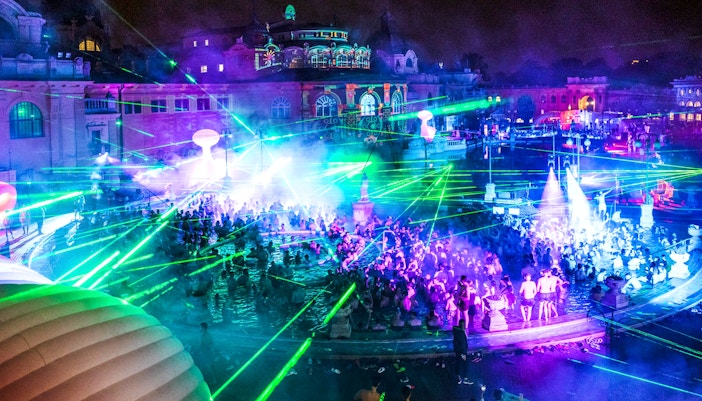 People enjoying a night pool party at Széchenyi Thermal Bath, Sparty Budapest.