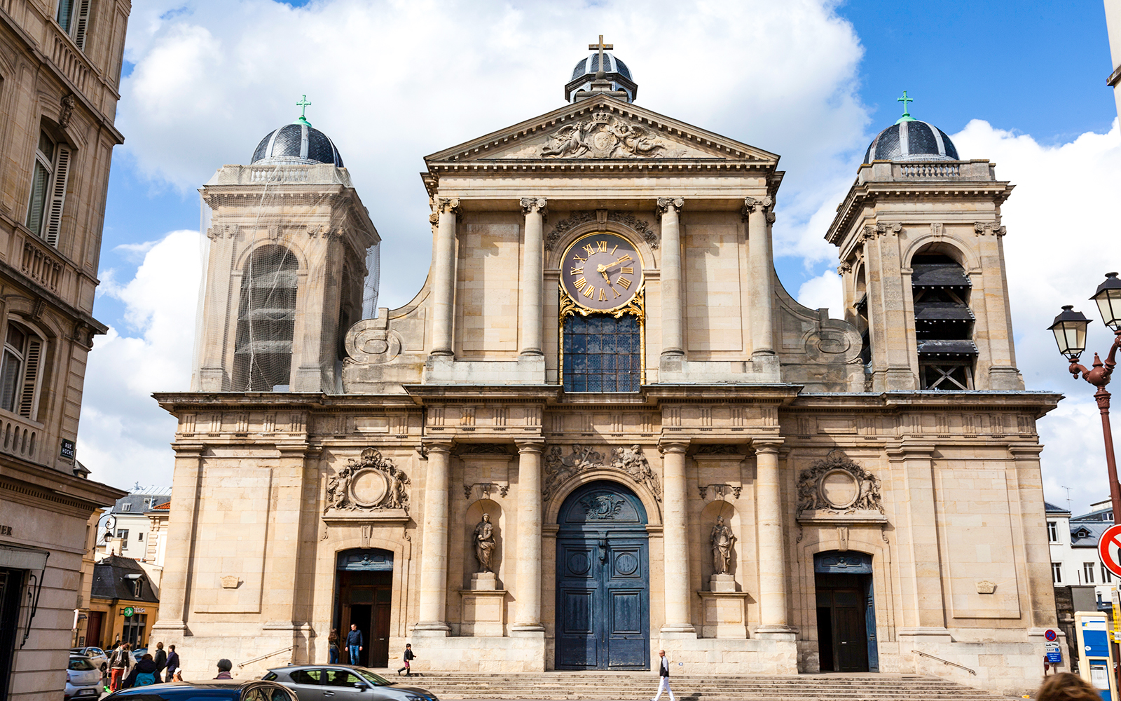 Versailles Cathedral Saint-Louis facade with clock and twin towers.