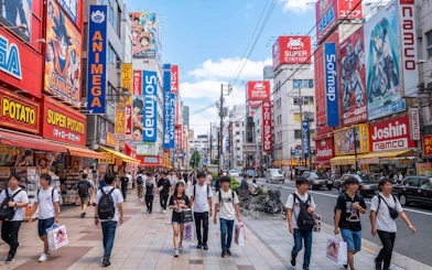 Walking tour in Osaka's Den Den Town with anime and retro game shops.