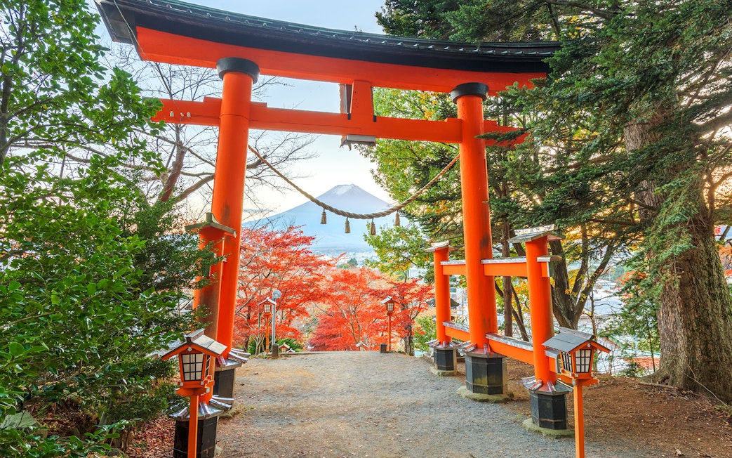 Entrance gate to Arakura Sengen Shrine with Mt. Fuji in the background, Fujiyoshida, Japan.