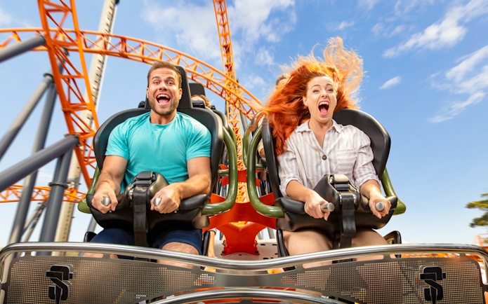 People enjoying a roller coaster ride at Dreamworld.