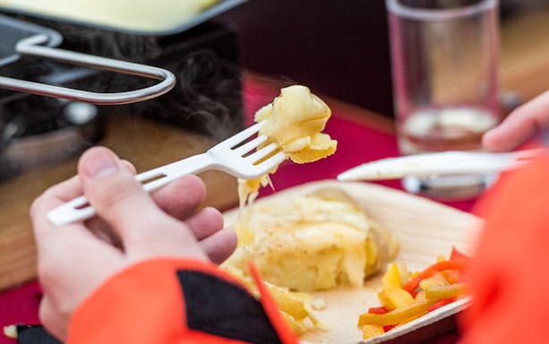Raclette dinner served after river rafting in Interlaken.