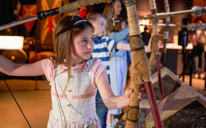Children practicing archery at Game of Thrones Studio Tour.