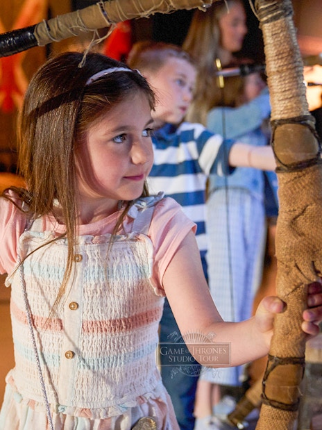 Children practicing archery at Game of Thrones Studio Tour.