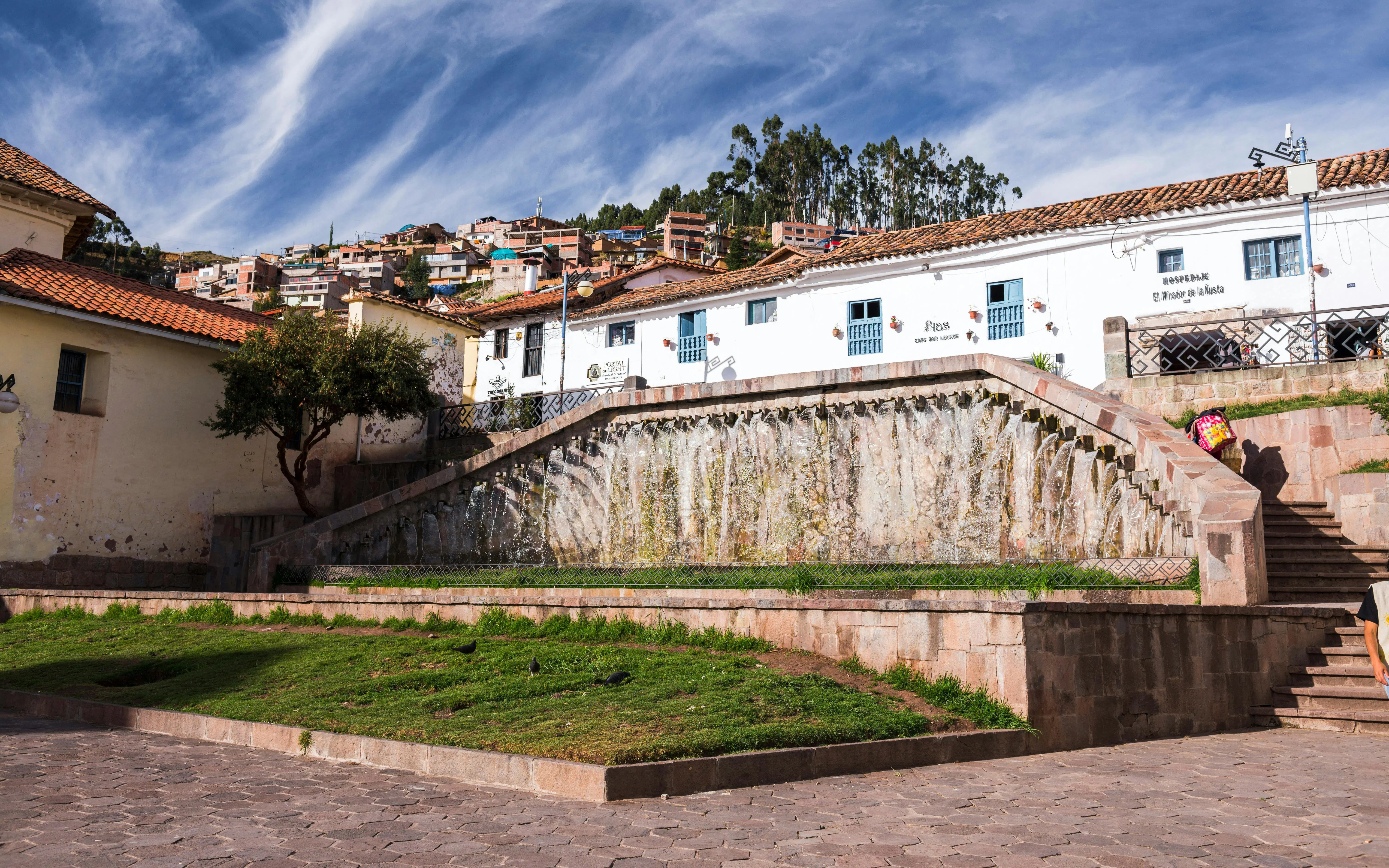San Blas Square in Cusco, Peru, featuring stone steps and colonial architecture.