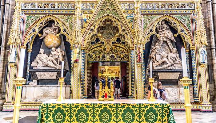 Sir Isaac Newton's Tomb in Westminster Abbey with ornate Gothic architecture.