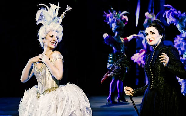 Theatre performers in elaborate costumes during The Phantom of the Opera on Sydney Harbour.
