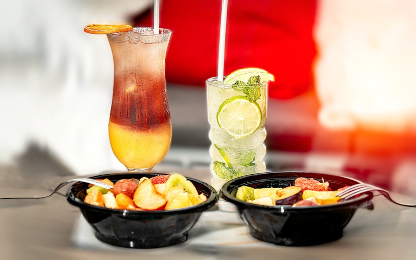 Fruit salad bowls and cocktails inside Szechenyi Bath Palm House.